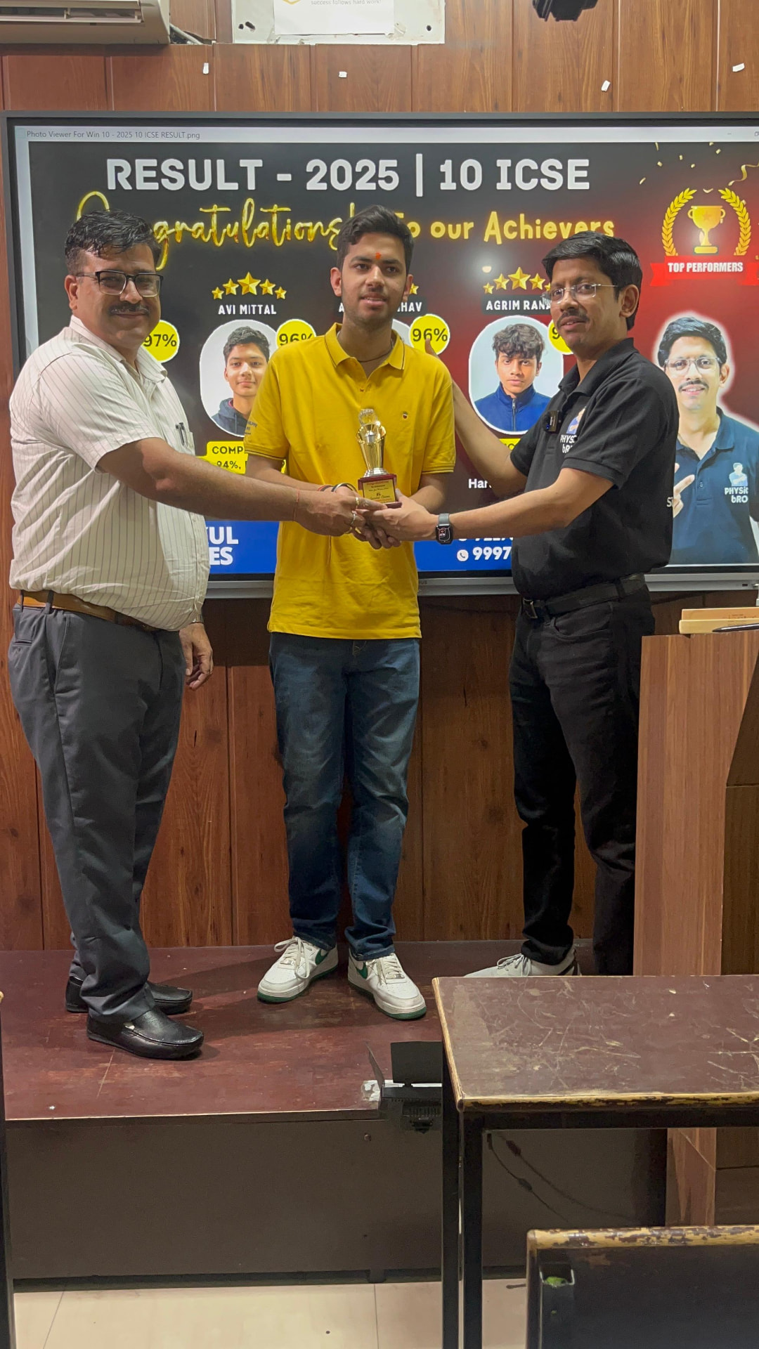 ICSE 2025 topper felicitated with a trophy by Gurukul Classes faculty